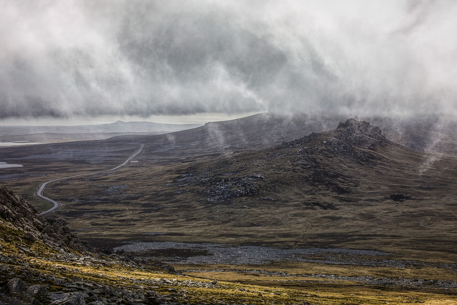 Misty hills with a road running through the landscape