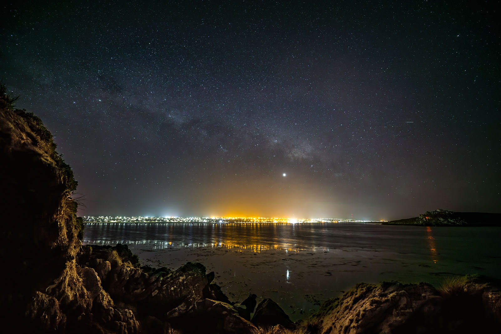 Stanley at night across the water