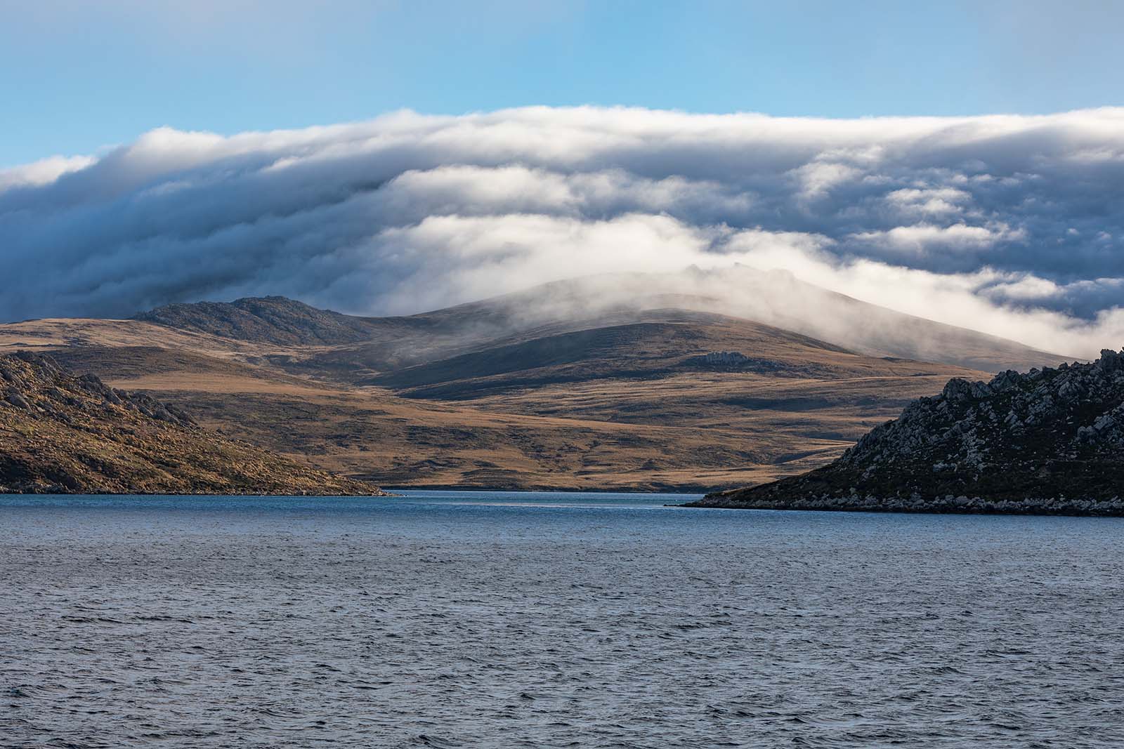 Coastal landscape under low cloud