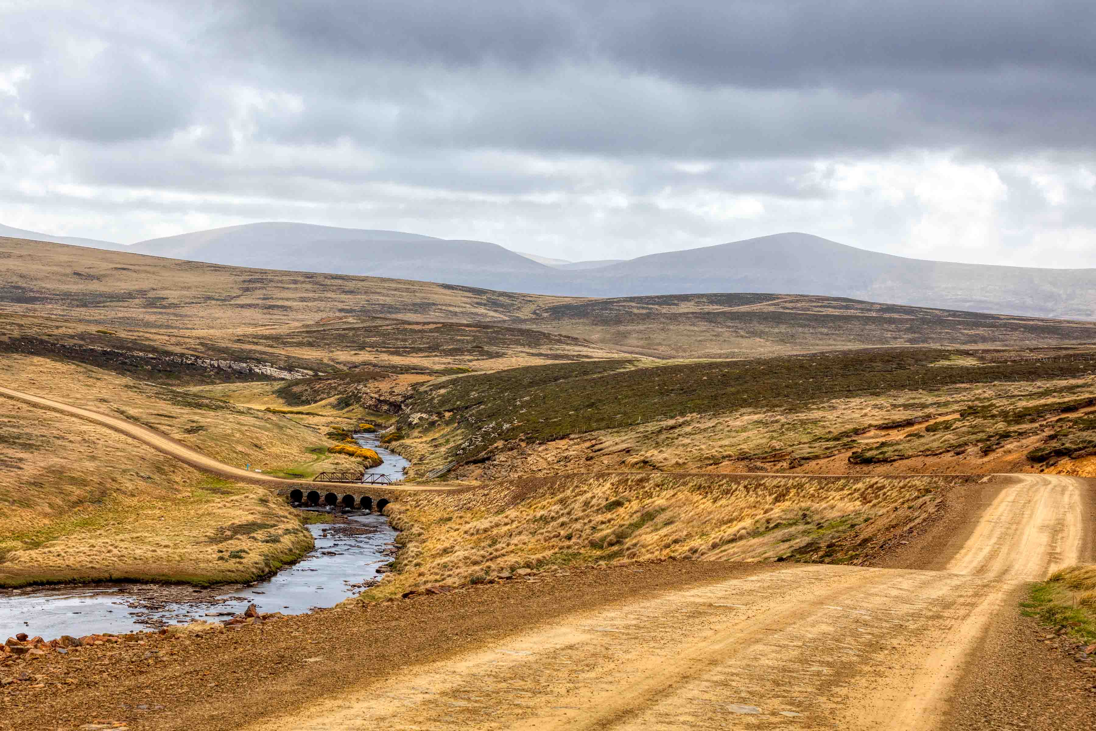 Directional view across a coastal settlement, used as a calm visual break